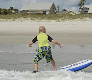 Learn to surf in St. Augustine Beach, Florida. Surf camps, private surf lessons, surf birthday parties, group surf classes.