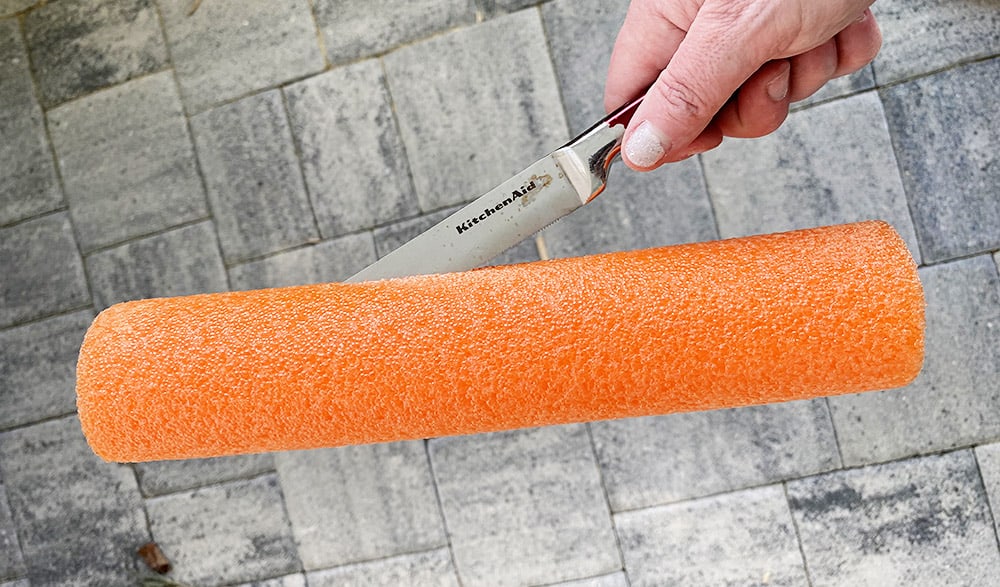 Using a pool noodle to make a DIY sand sifter